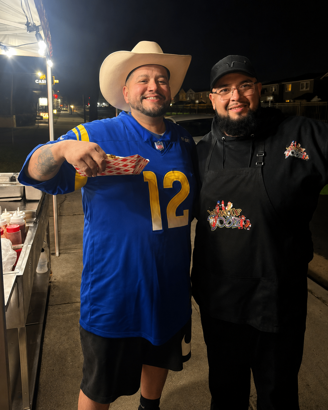Happy customer posing with the What Up Dogz team
